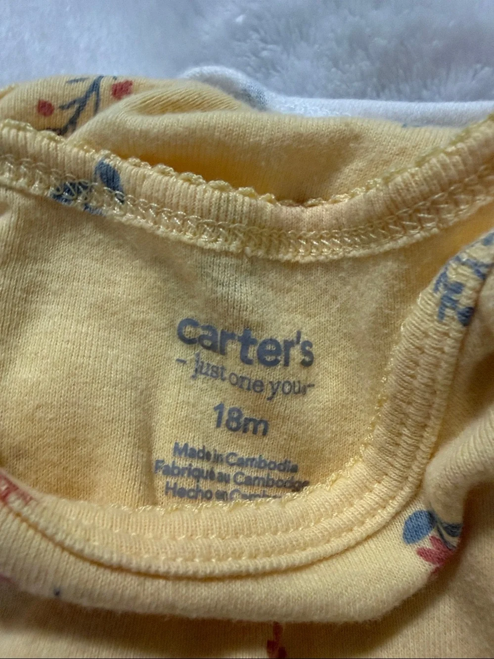 Carter's Yellow Floral Short-Sleeve Baby Bodysuit Set with Blue and Red Accents.
